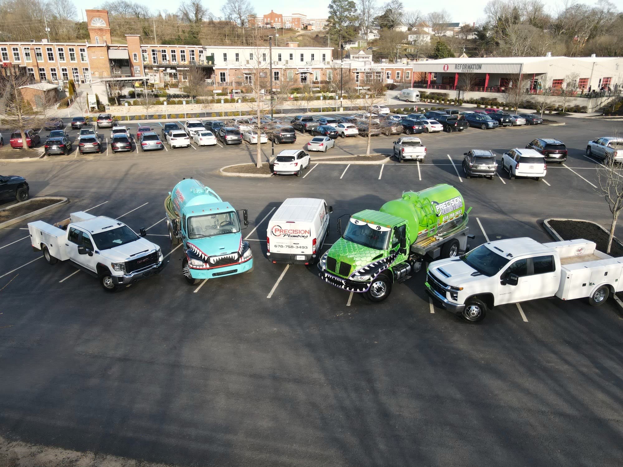 The Precision Plumbing & Septic fleet serving North Georgia