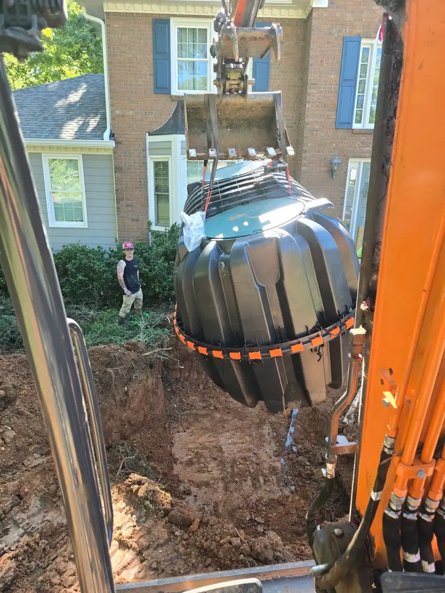 Precision tech installing a septic riser — Canton, GA